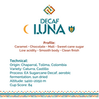 A digital graphic card for Decaf Luna coffee, featuring the brand logo at the top, flavor profile details in red text, and technical specifications in blue text on a white background with a decorative geometric border at the bottom.