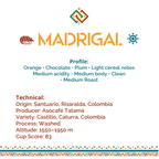 A white information card for the product Madrigal, featuring the brand name in orange. Text below describes the coffee profile - Orange, Chocolate, Plum, Light cereal notes, medium acidity, medium body, clean, medium roast. And technical details, including origin Santuario, Risaralda, Colombia; producer Asocafé Tataré; variety Castillo, Caturra, Colombia; washed process; altitude 1550-1950 m; cup score 83.